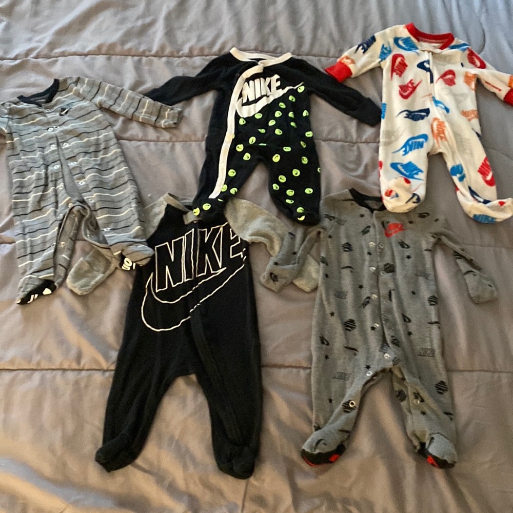 Five Nike onesies for a baby boy. All three months size. Gently used like new.